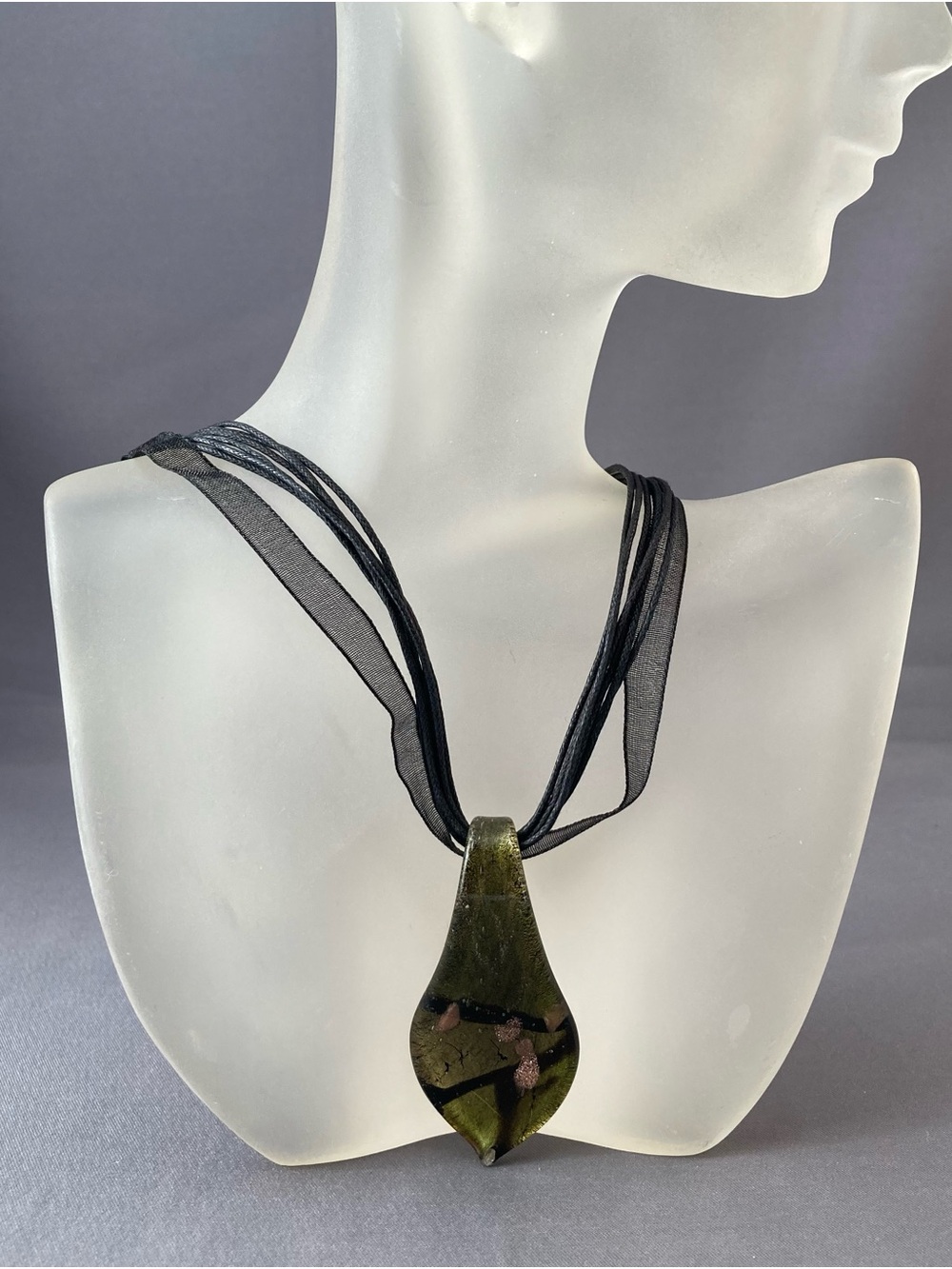 Green glass pendant necklace on black cords 18”